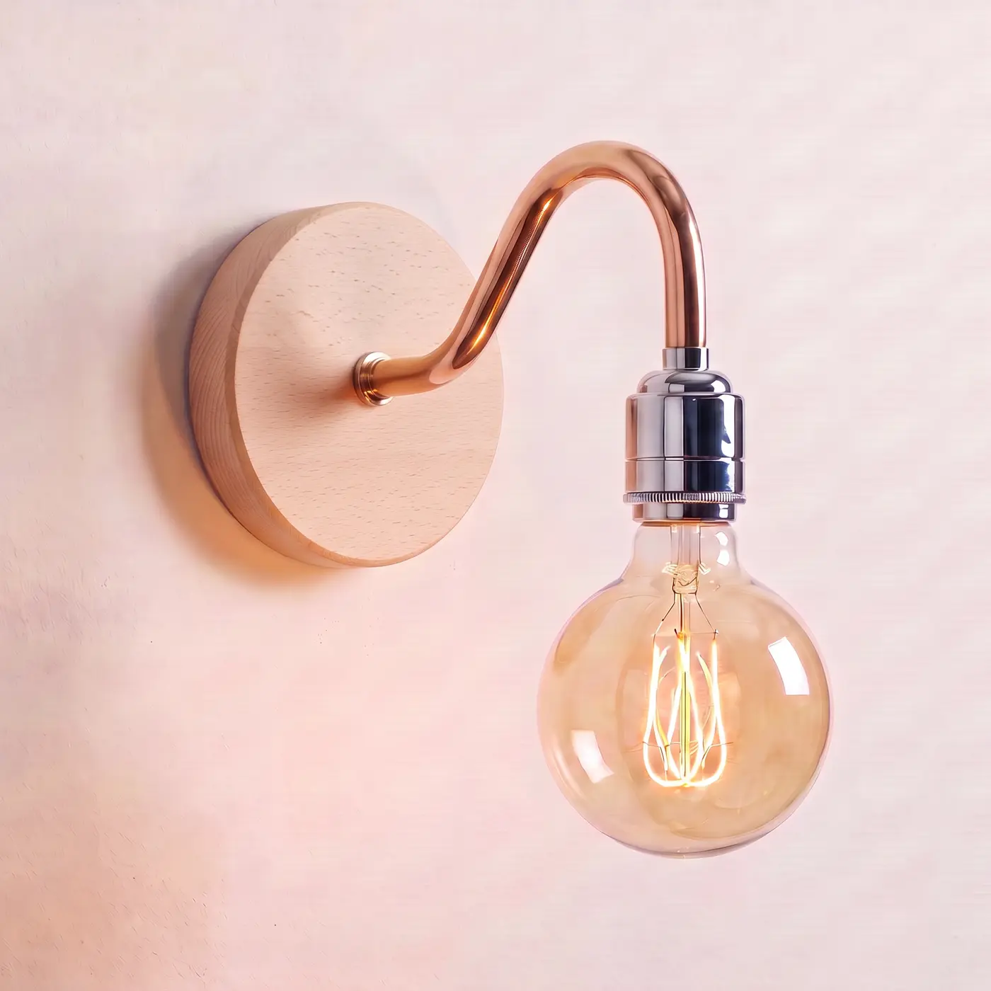 Swan neck wall light with a beech back plate, copper swan neck arm and chrome bulb holder, lit with a globe filament bulb